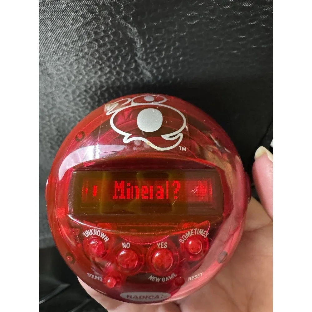 Set of 2 Radica 20Q Handheld Electronic Games Regular and Rock and Pop Music